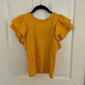 Yellow ruffled short sleeve shirt